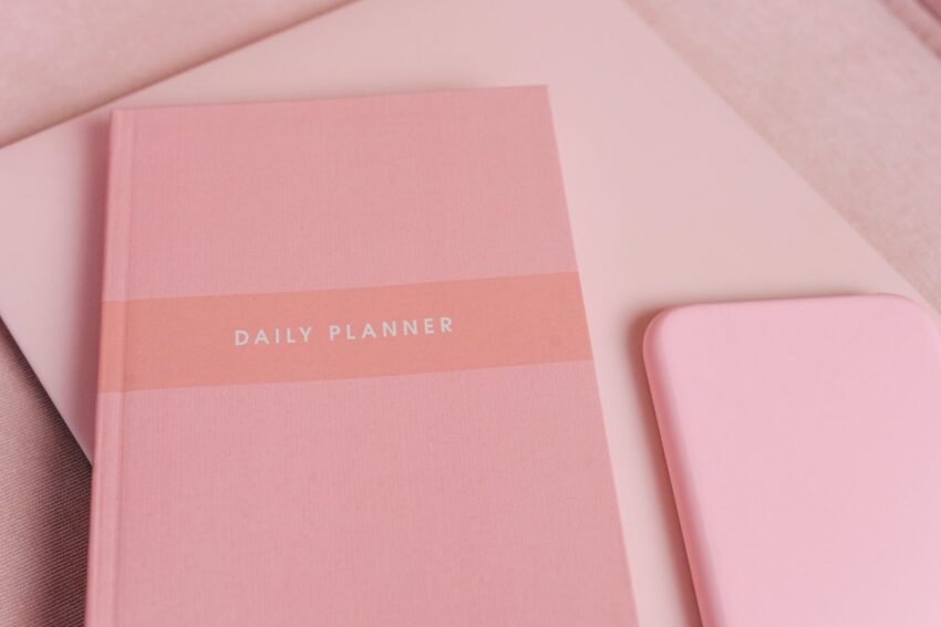 a pink planner on the table
